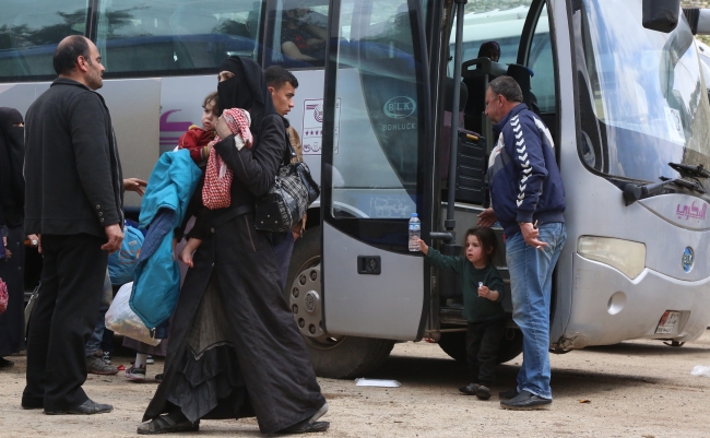 Doğu Guta'dan zorunlu tahliyeler sürüyor